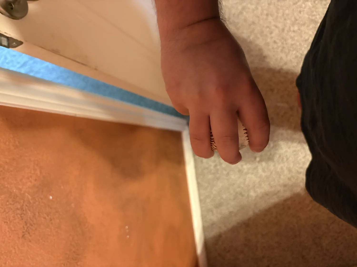 The underside of a three-finger changeup grip.